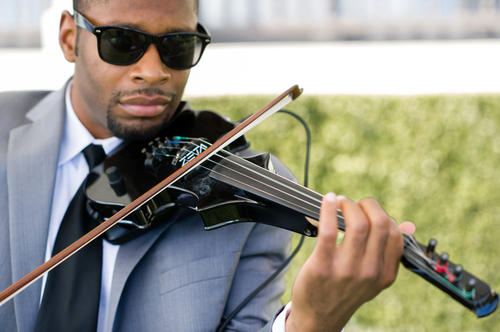 Maestro Hughes, a phenomenal violinist flown in by bride and groom