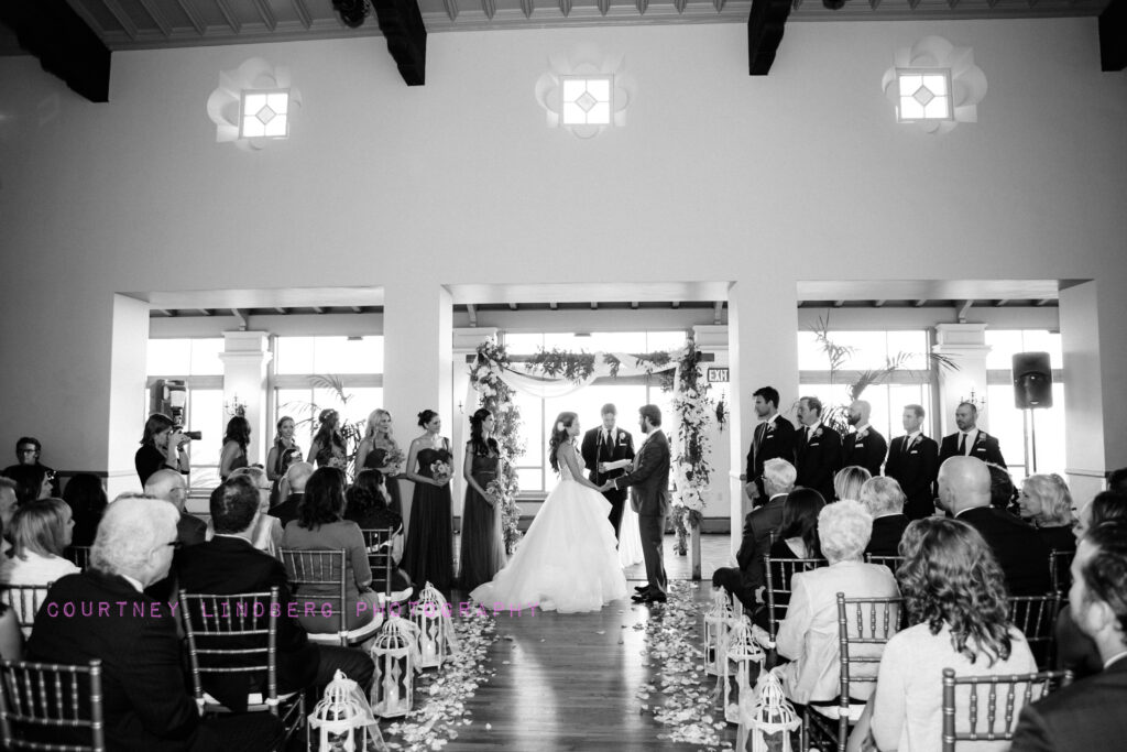 Bride and Groom in front of Rustic Chuppah at Bel Air Bay Club