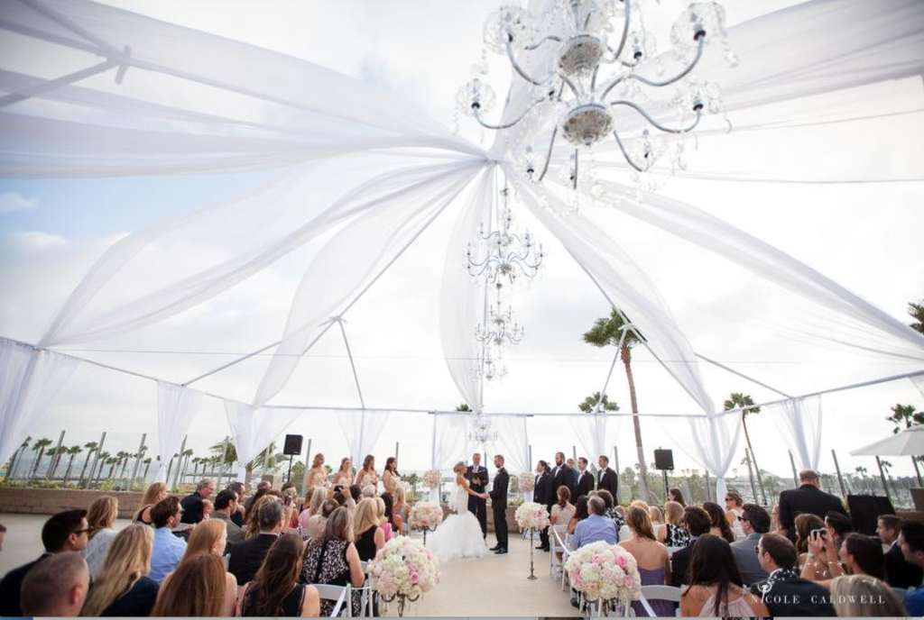 Open air tent with chandelier for wedding at Crowne Plaza Hotel in Redondo Beach
