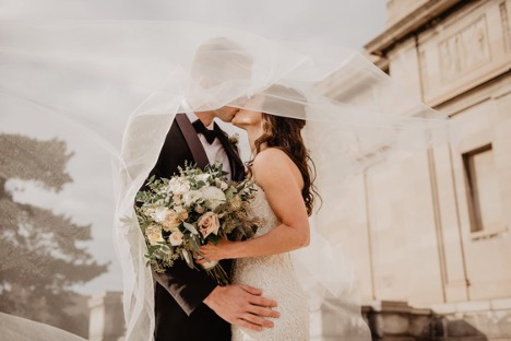 Wedding bride and groom kissing